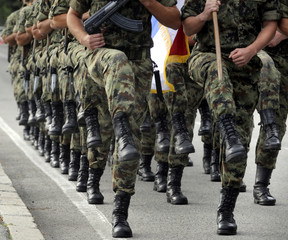Soldiers marching with rifles