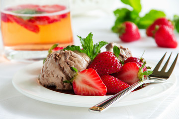 Chocolate ice cream with strawberries in balsamic sauce.