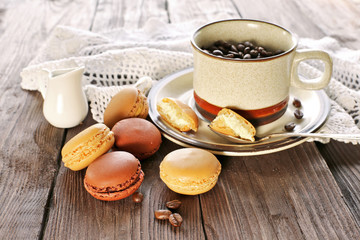 Morning coffee with macaroons on wooden table