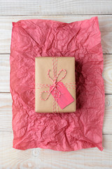 Plain Wrapped Present on Tissue Wood Table