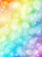 Bokeh background. Rainbow bokeh. Colorful abstract background. Bokeh lights. Defocused lights. Rainbow gradient. Sunlight on decorative vertical texture. Vertical background.