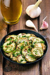 Sauteed zucchinis in frying pan