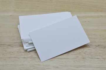 Blank business cards on wooden office table