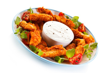 Fried chicken nuggets and vegetables