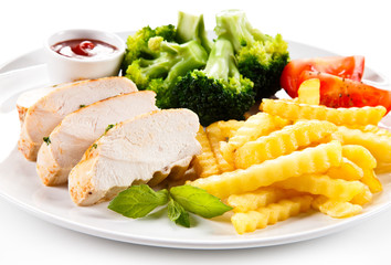 Grilled chicken fillet and vegetables on white background 