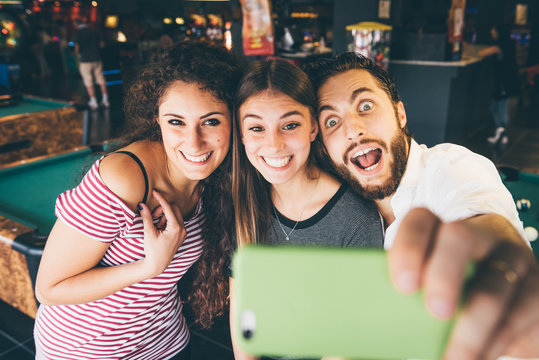 Group of friends enjoying spending time together and making a selfie.