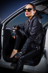 Young woman in leather clotes