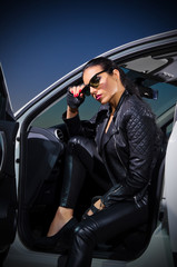 Young woman in leather clotes