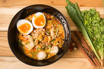 Thai noodle soup in a bowl taste spicy noodle soup and boiled eg