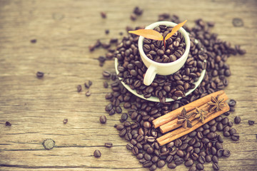 Coffee cup and coffee bean on a wooden table and Coffee plant.vi