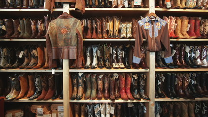 wall of cowboy boots at a western wear store