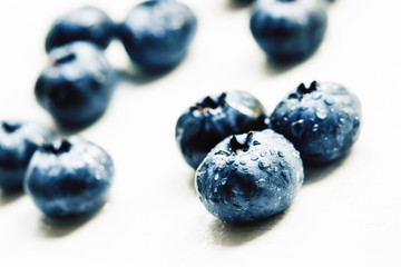 Fresh ripe blueberries on white background, selective focus