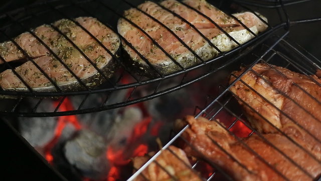 Meat on the grill with flames closeup