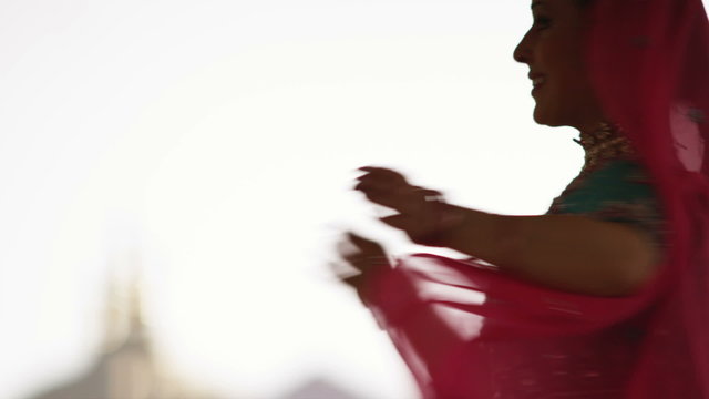 woman performing an Indian dance for Holi
