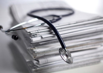 books folder file and stethoscope isolated on white background