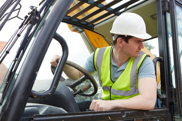 Construction Worker Driving Digger
