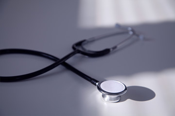 Black stethoscope in blue shade, close up