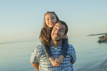 Father with is daughter at the sunset