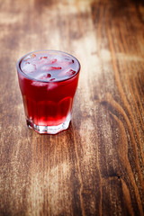 red drink with ice