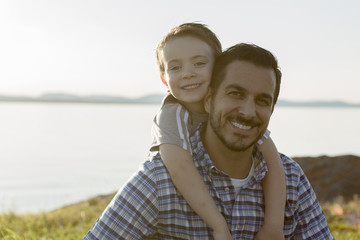 Father with is son at the sunset