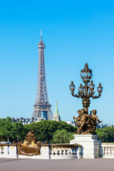 Fototapeta na wymiar Pont Alexandre III Bridge (Lamp post details) & Eiffel Tower, Pa