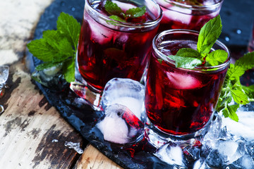 Pomegranate drink with mint and ice, selective focus
