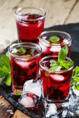 Pomegranate drink with mint and ice, selective focus