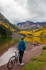 Cyclist at Maroon Bells in Fall