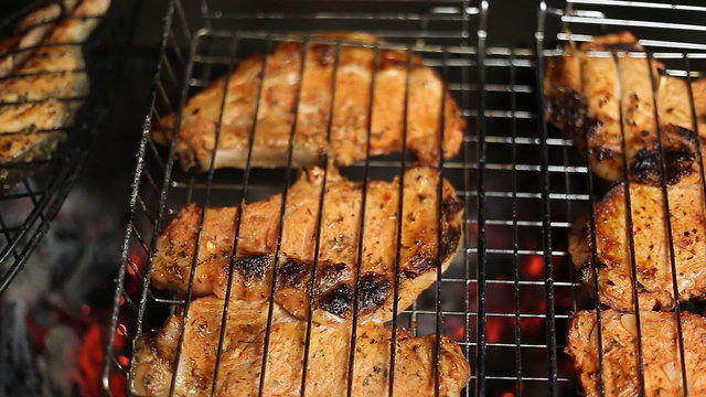Meat on the grill with flames closeup