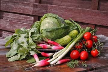 Cabbage , tomatoes, green onion, cucumber on table