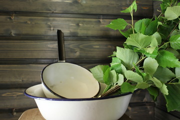 Sauna interior. Traditional sauna from Finland. Equipment and birch whisk. Whisk is used for body massage.