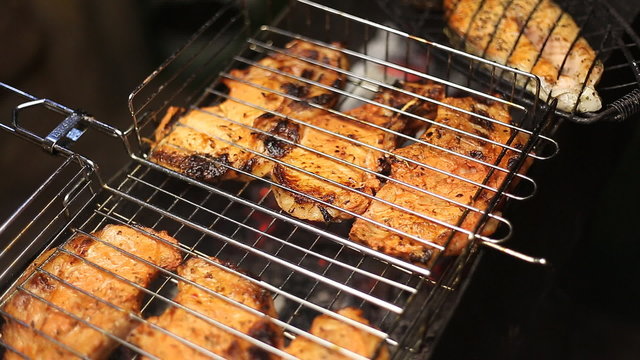Meat on the grill with flames closeup