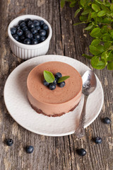 Mini-cheesecake and chocolate biscuits and blueberries