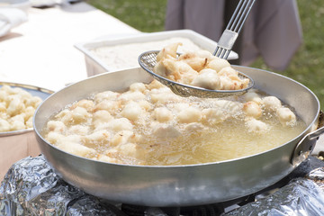 close-up of a pan with the fish inside fried