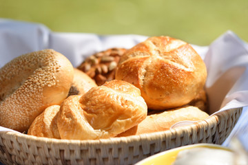 breadbasket with different varieties of bread rolls
