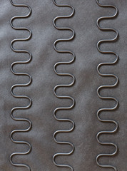Coil sinuous wire spring system