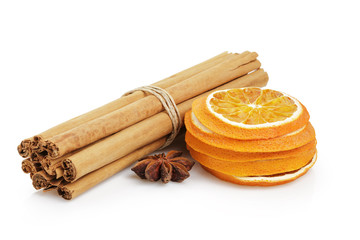 dried oranges with cinnamon and anise, isolated on white