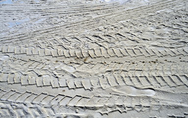 Hintergrund Reifenspuren im Sand