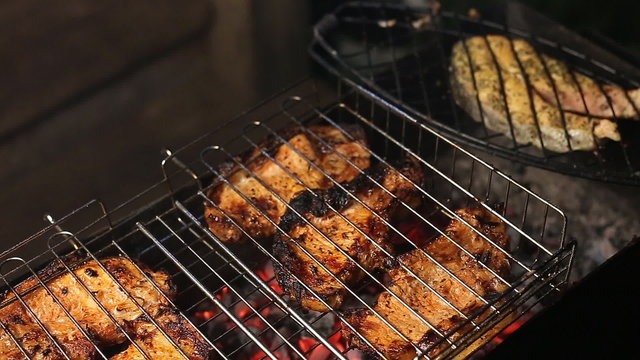 Meat on the grill with flames closeup