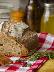 Fresh Tradition bread laying on the old Wooden cutting board