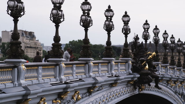 couple on a bridge taking a picture