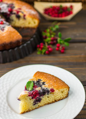 Sponge cake with berries - cranberries and blueberries
