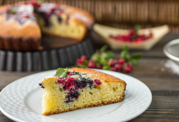 Sponge cake with berries - cranberries and blueberries
