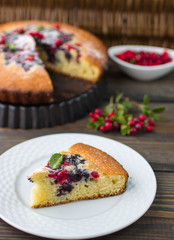 Sponge cake with berries - cranberries and blueberries
