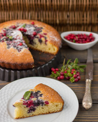 Sponge cake with berries - cranberries and blueberries
