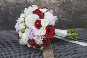 Wedding bouquet with peonies and roses