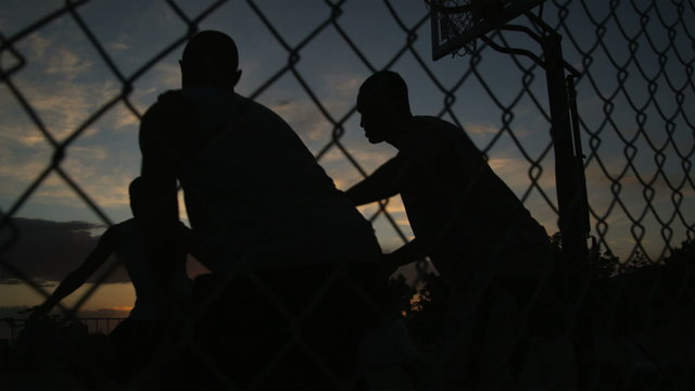 WS TU Men playing basketball at night / Salt Lake City, Utah, USA.