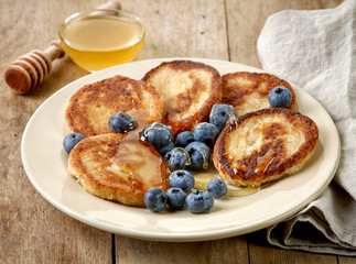 Pancakes with honey and blueberries
