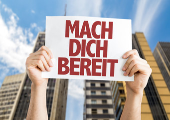 Get Ready (in German) placard with cityscape background
