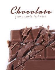 Chopped bar of chocolate isolated on white